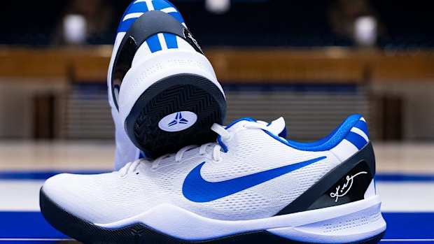 Side view of Duke's white and blue Nike Kobe sneakers.